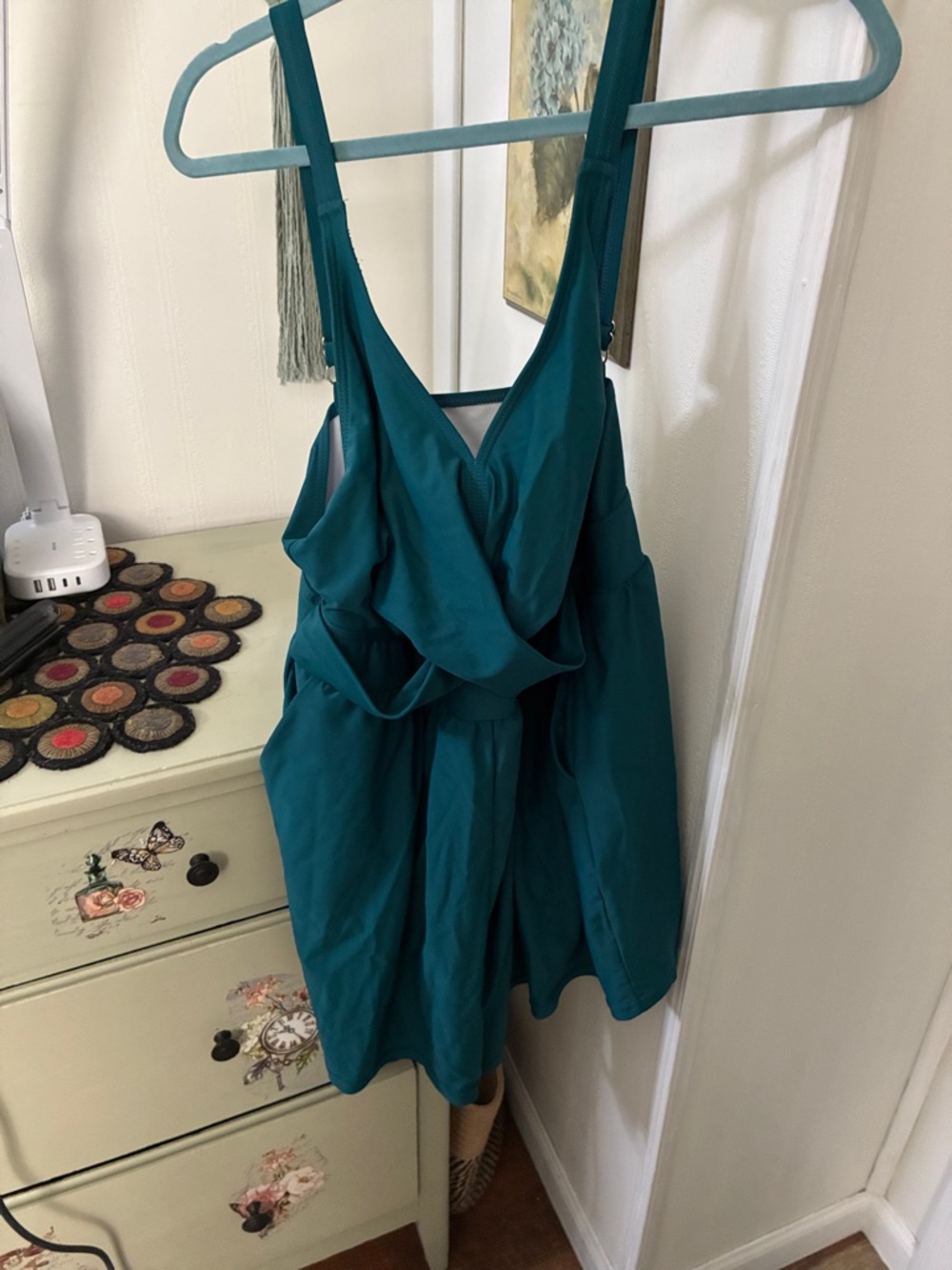 Green one piece swimsuit with shorts